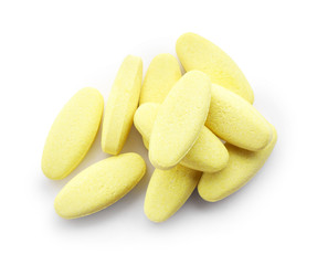 Heap of pills on white background