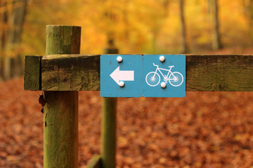 Off Road Bike Track. A cycle path sign in an autumnal rural woodland setting