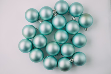 Christmas balls mint color on a light background.