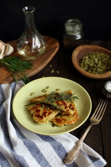 potato pancakes on a dark wooden background.