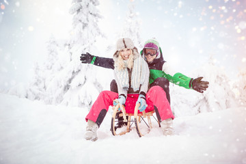 Fototapeta na wymiar love couple having fun in snow