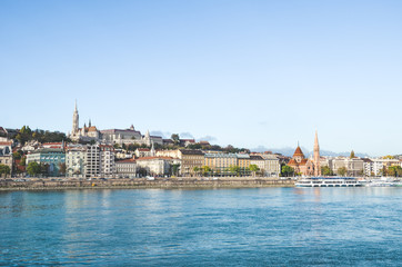 Danube river in Budapest, Hungary. The historic old town in the background with famous Matthias Church or Fishermans Bastion. Cityscape of the Hungarian capital. Tourist destinations