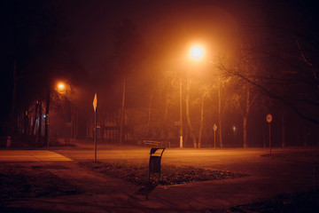 Empty intersection at night during low fog