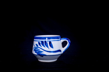 cup of talavera on elegant black background