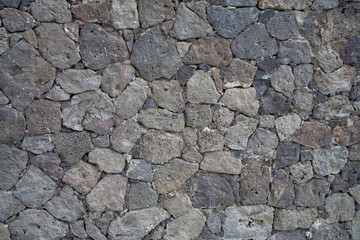 beautiful original backdrop of volcanic lava wall in close-up in daylight