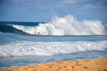 7/10: Hawaiian Surfer Taking on a Massive Rainbow Wave at the Banzai Pipeline, Oahu, Hawaii