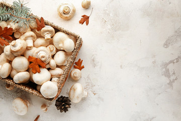 Fototapeta na wymiar Basket with fresh mushrooms on white background