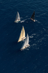 French Riviera - modern sail race with four boat above aerial view in St -Tropez
