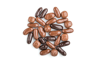 Pile of dark and milk chocolate candies isolated on white background. close up, top view.