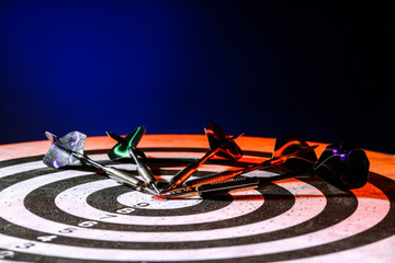 Obraz premium Dartboard with darts, closeup view