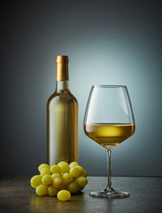 glass and bottle of white wine
