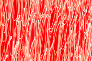 Futuristic blurred lights holiday monochrome background in coral orange. Horizontal, soft focus