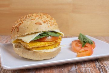 Egg omelette sandwich with cheese and tomato
