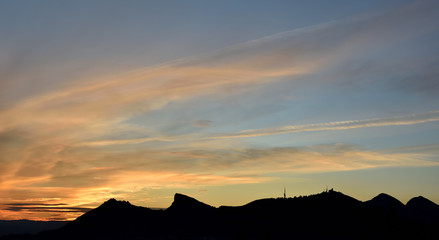 Sunset with different tones and clouds over Sierra Elvira in Granada