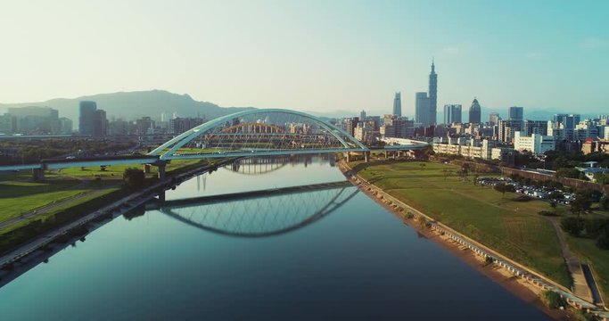 Aerial shot of central Taipei city with Rainbow bridge and Keelung river at dawn, Taiwan