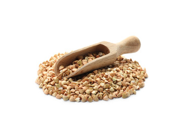 Scoop with pile with green buckwheat isolated on white