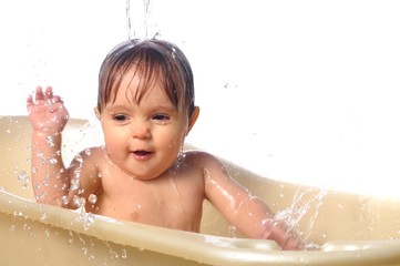 Cute little girl portrait in the bath
