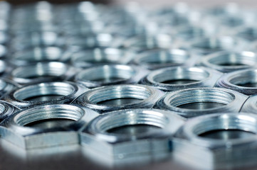 Side view close-up chrome metal nuts