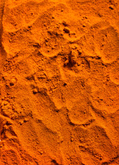 Turmeric powder spice background.