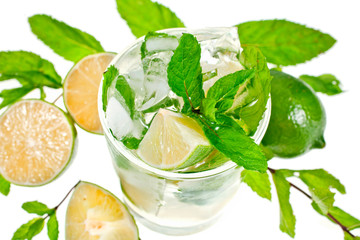 Mojito cocktail with lime and mint on white background