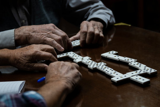 Men playing dominoes game in senior center