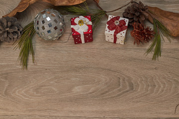 christmas ornaments over wood, gifts