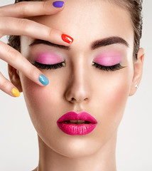 Naklejka premium Beautiful fashion woman with a colored nails. Attractive white girl with multicolor manicure.