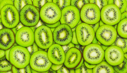 Fototapeta na wymiar Kiwi slices, fruits background. Food texture