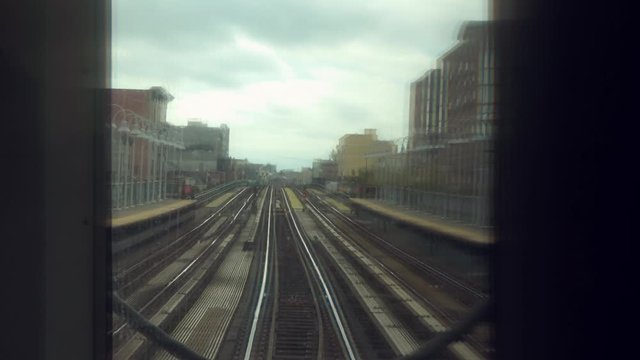 Looking out the window of a subway train in new York city moving through the subway rails
