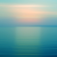 Abstract blue background motion blur sunset on the sea