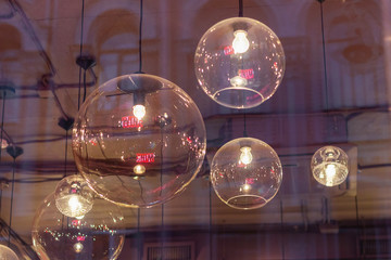 transparent round lampshades with incandescent bulbs. design illumination