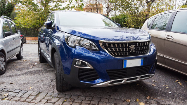An aggressive front view of new new SUV 5008 from Peugeot automaker in blue color,Rome,Italy - November 16, 2019