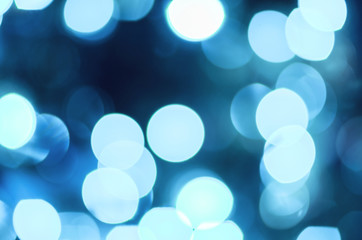 Bright bokeh with defocused lights for the background. Blue Blur lights for Christmas, New Year, Holiday wallpaper, Party