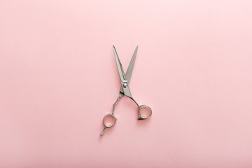 Hairdresser tools. Hairdresser scissors on pink color background with copy space for text. Hairdresser service. Beauty salon service - obrazy, fototapety, plakaty