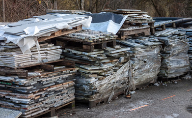 piles broken granite slices trash dump pollution