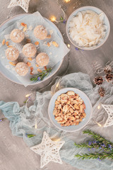 Homemade sweet white chocolate and coconut in a plate. Raffaello candy - snowball truffles on a Christmas table. Top view