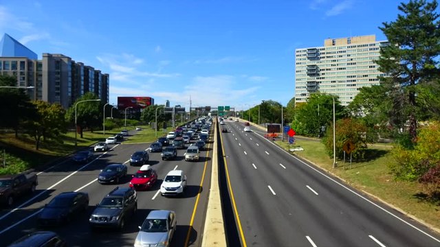 4K. Time lapse full traffic in Philadelphia. North American countryside landscape in autumn with a blue sky with clouds. Traffic concept.