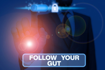 Writing note showing Follow Your Gut. Business concept for Listen to intuition feelings emotions conscious perception