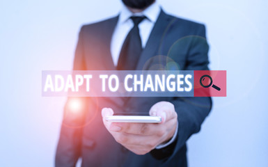 Word writing text Adapt To Changes. Business photo showcasing Embrace new opportunities Growth Adaptation progress Male human wear formal work suit hold smart hi tech smartphone use one hand