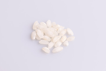 Italian Risotto rice on white background. Copy Space. Soft light. Latin term 