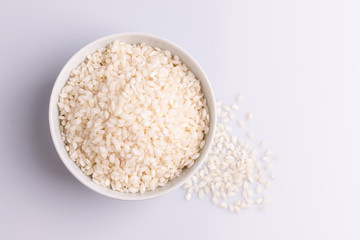 Italian Risotto rice on white background. Copy Space. Soft light. Latin term 