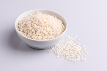Italian Risotto rice on white background. Copy Space. Soft light. Latin term 
