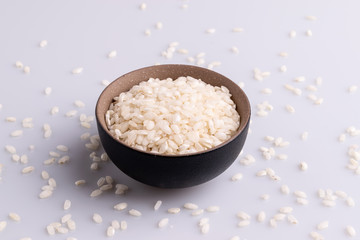 Italian Risotto rice on white background. Copy Space. Soft light. Latin term 