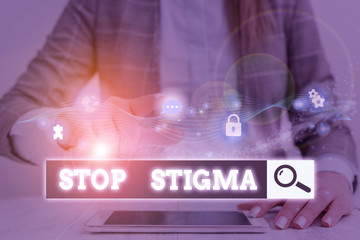 Conceptual hand writing showing Stop Stigma. Concept meaning end the feeling of disapproval that...