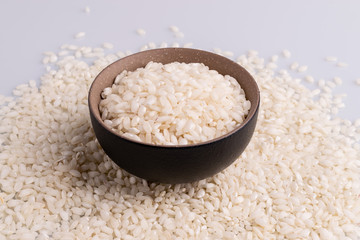 Italian Risotto rice on white background. Copy Space. Soft light. Latin term 