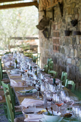 Dinner table after family style meal in Tuscany, Italy