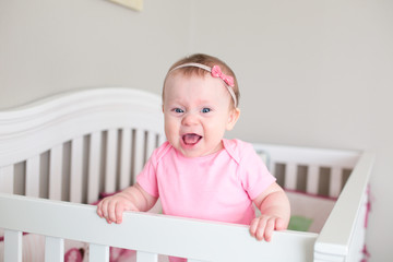 Close up Portrait of Cute 8 Month Old baby Girl with Big blue Eyes, Happy Baby Girl