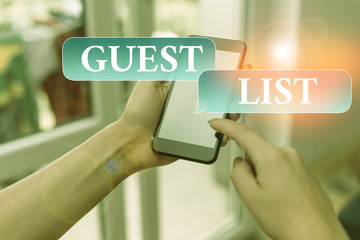 Text sign showing Guest List. Business photo text a list of showing who are allowed to enter the show or an event woman using smartphone office supplies technological devices inside home