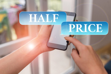 Text sign showing Half Price. Business photo text half the usual price at which something is offered for sale woman using smartphone office supplies technological devices inside home