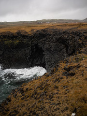 View of the amazing cliffs in Arnarstapi, a village on the southern side of the Snæfellsnes peninsula. Iceland.
